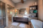 A walk in shower, double vanity and large soaking tub offers a perfect place to rest your muscles after a day on the mountain